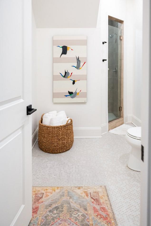 Brand-new guest bathroom with penny mosaic flooring.